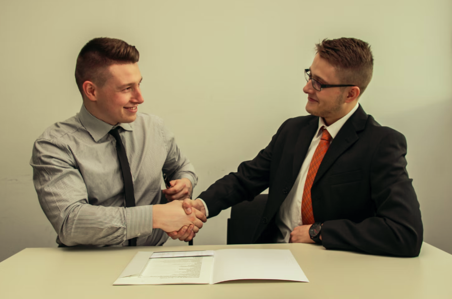Investors Shaking Hands